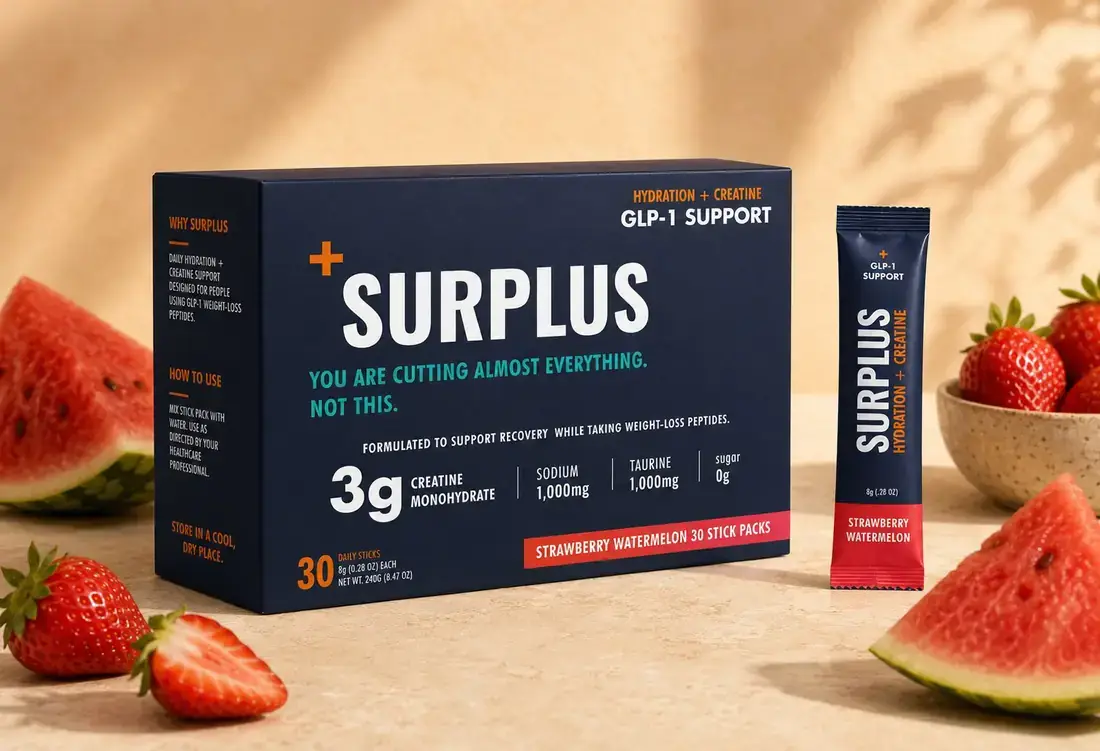 Surplus Strawberry Watermelon carton with a single stick pack, beside fresh strawberries and watermelon.